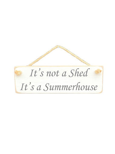 30cm x 10cm, Solid wood decorative garden sign, handmade in the UK by Austin Sloan with a humorous shed quote "It's not a shed It's a summerhouse" in a antique white colour