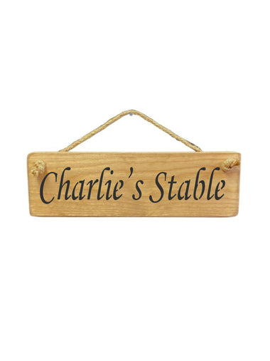 30cm x 10cm, solid wood decorative personalised stable sign, handmade in the UK by Austin Sloan with a personalised horse lovers quote "Charlie's Stable" in a natural wood colour