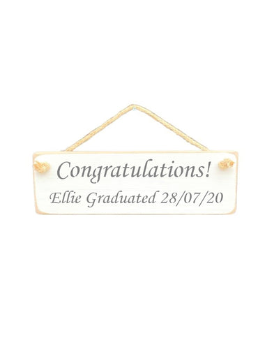 30cm x 10cm, Solid wood decorative personalised graduation sign, hand made in the UK by Austin Sloan with a personalised congratulations quote "Congratulations! Ellie Graduated 28/07/20" in a antique white colour