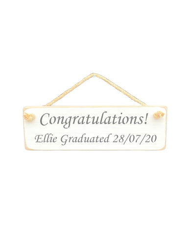 30cm x 10cm, Solid wood decorative personalised graduation sign, hand made in the UK by Austin Sloan with a personalised congratulations quote "Congratulations! Ellie Graduated 28/07/20" in a antique white colour