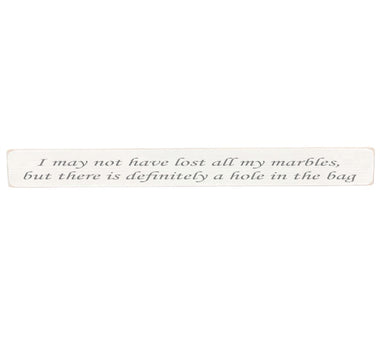 90cm x 10cm, Solid wood decorative home sign, handmade in the UK by Austin Sloan with a humorous quote "I may not have lost all my marbles, but there is definitely a hole in the bag" Antique white wood with black wording