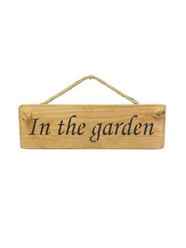 30cm x 10cm, Solid wood decorative garden sign, handmade in the UK by Austin Sloan with a garden quote "In the garden" in natural wood colour