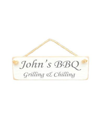 30cm x 10cm, Solid wood decorative personalised garden sign, handmade in the UK by Austin Sloan with a personalised quote "John's BBQ Grilling & Chilling" in a antique white colour