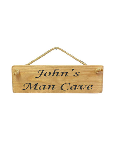 30cm x 10cm, solid wood decorative personalised shed sign, handmade in the UK by Austin Sloan with a personalised Man Cave quote "John's Man Cave" in a natural wood colour