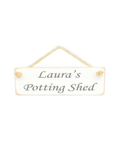 30cm x 10cm, solid wood decorative personalised shed sign, handmade in the UK by Austin Sloan with a personalised potting shed quote "Laura's Potting Shed" in a antique white colour