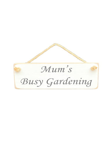 30cm x 10cm, Solid wood decorative garden sign, handmade in the UK by Austin Sloan with a gardeners quote "Mum's Busy Gardening" in a antique white colour