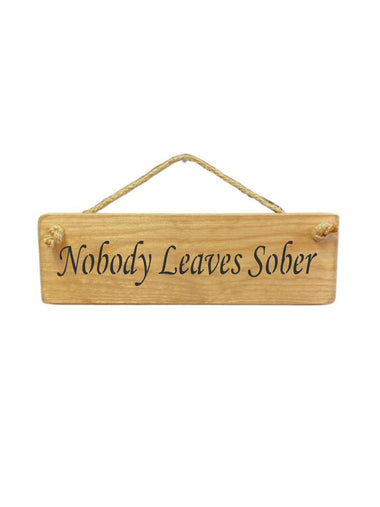 30cm x 10cm, Solid wood decorative kitchen sign, handmade in the UK by Austin Sloan with a humorous alcohol lovers quote "Nobody Leaves Sober" in a natural wood colour