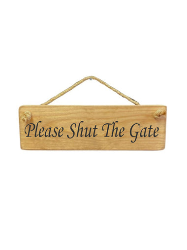 30cm x 10cm, solid wood decorative gate sign, handmade in the UK by Austin Sloan with a gate quote "Please Shut The Gate" in a natural wood colour 