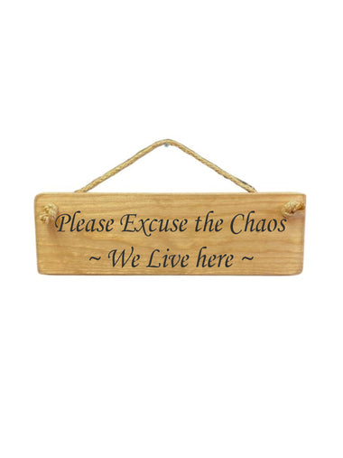 30cm x 10cm, solid wood decorative family sign, handmade in the UK by Austin Sloan with a humorour family quote "Please Excuse the Chaos ~ We Live here ~" in a natural wood colour