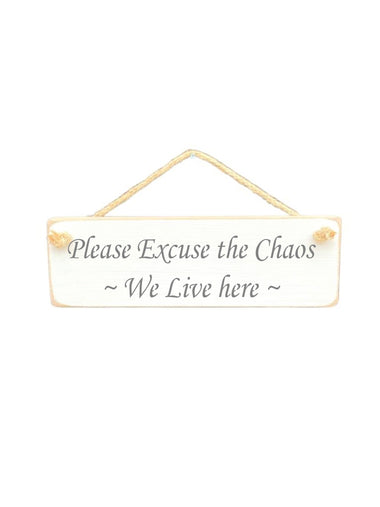 30cm x 10cm, solid wood decorative family sign, handmade in the UK by Austin Sloan with a humorour family quote "Please Excuse the Chaos ~ We Live here ~" in a antique white colour