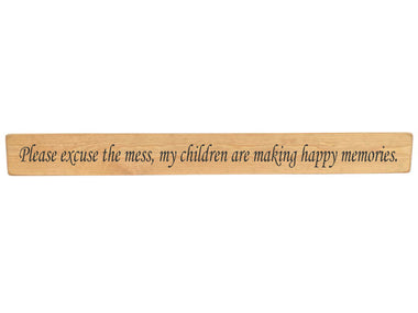 90cm x 10cm, Solid wood decorative living room sign, handmade in the UK by Austin Sloan with a true inspirational quote "Please excuse the mess, my children are making happy memories." Natural wood with black wording