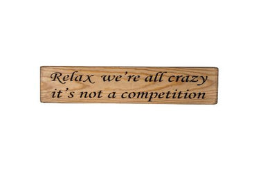 Relax, we're all crazy it's not a competition 45cm wood sign