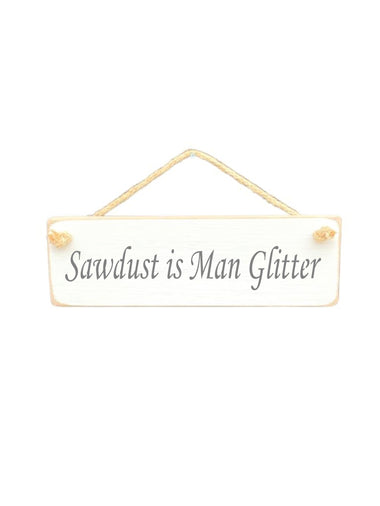 30cm x 10cm, solid wood decorative humorous sign, handmade in the UK by Austin Sloan with a humorous quote "Sawdust is Man Glitter" in a antique white colour