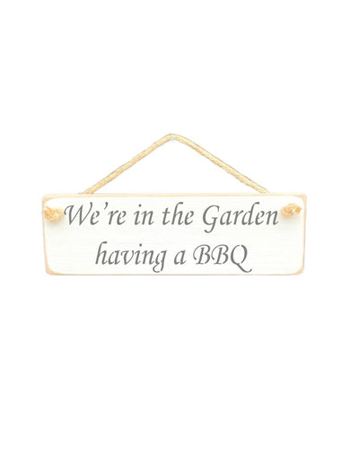 30cm x 10cm, Solid wood decorative garden sign, handmade in the UK by Austin Sloan with a bbq lovers quote "We're in the Garden having a BBQ" in a antique white colour