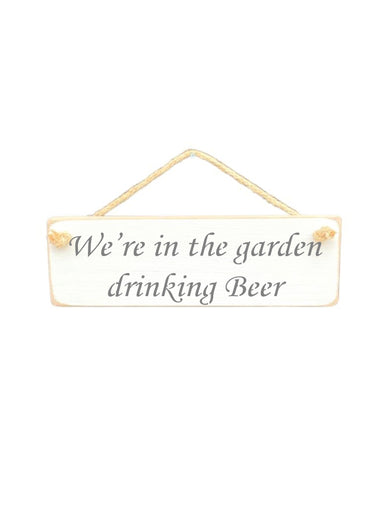 30cm x 10cm, Solid wood decorative garden sign, handmade in the UK by Austin Sloan with a alcohol lovers quote "We're in the garden drinking Beer" in a antique white colour