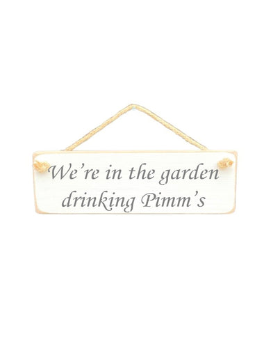 30cm x 10cm, Solid wood decorative garden sign, handmade in the UK by Austin Sloan with a alcohol lovers quote "We're in the garden drinking Pimm's" in a antique white colour