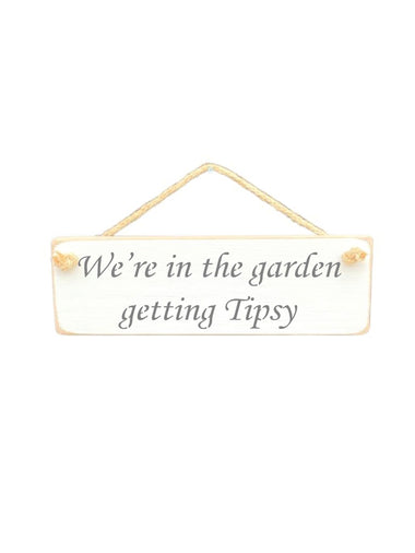 30cm x 10cm, Solid wood decorative garden sign, handmade in the UK by Austin Sloan with a alcohol lovers quote "We're in the garden getting Tipsy" in a antique white colour