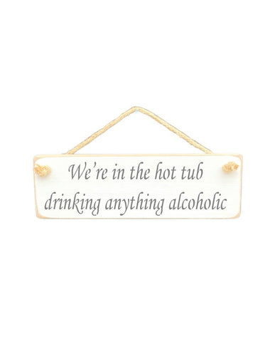 30cm x 10cm, Solid wood decorative hot tub sign, handmade in the UK by Austin Sloan with a alcohol lovers quote "We're in the hot tub drinking anything alcoholic" in a antique white colour