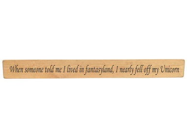 90cm x 10cm, Solid wood decorative home sign, handmade in the UK by Austin Sloan with the humorous quote "When someone told me I lived in fantasyland, I nearly fell of my unicorn" Natural wood with black wording